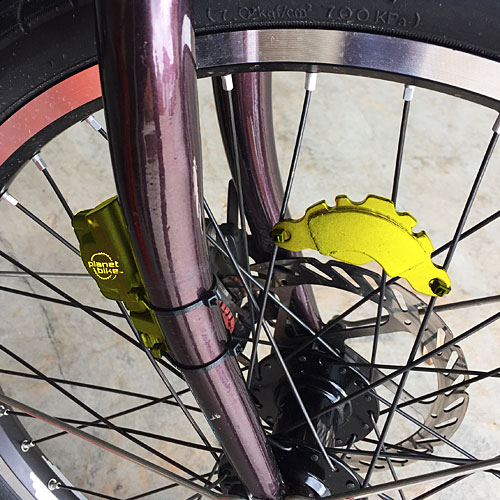 Hard drive magnet mounted to front wheel of bicycle