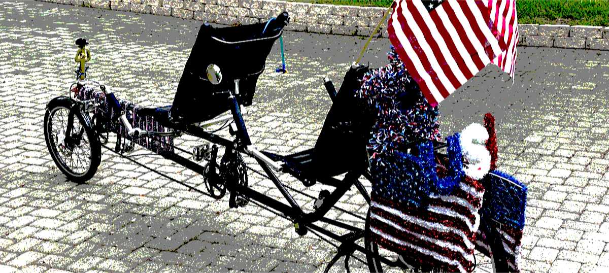 Stylized photo of a recumbent tandem bicycle decorated for the Fourth of July