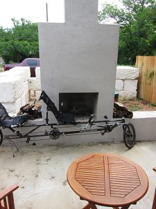 Photo: Bike parked in front of outdoor fireplace