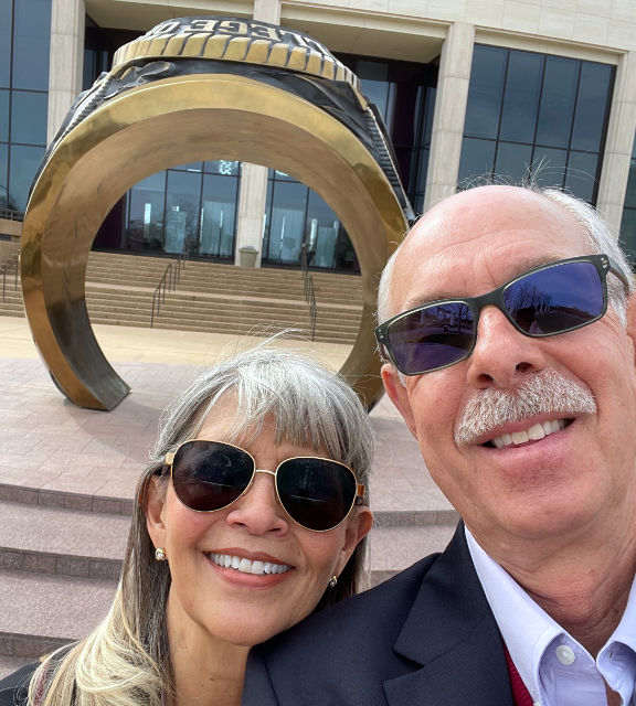 Photo: My wife & I in front of the giant Aggie ring at the Clayton W. Williams, Jr. Alumni Center on the campus of Texas A&M University, College Station, TX