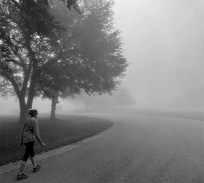Photo: My wife walking along a neighborhood street on a very foggy morning in Horseshoe Bay, TX