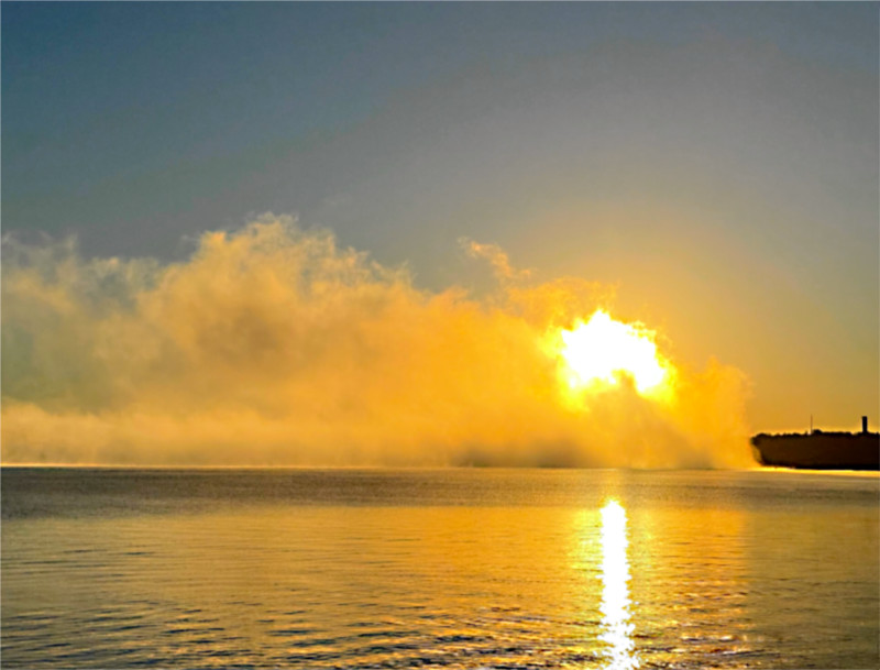 Photo: Steam fog at sunrise,  obscuring the dam on Lake LBJ, Texas