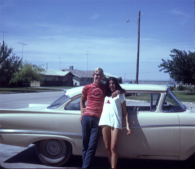 Photo: My wife and I as teenagers posing next to a 1958 Ford