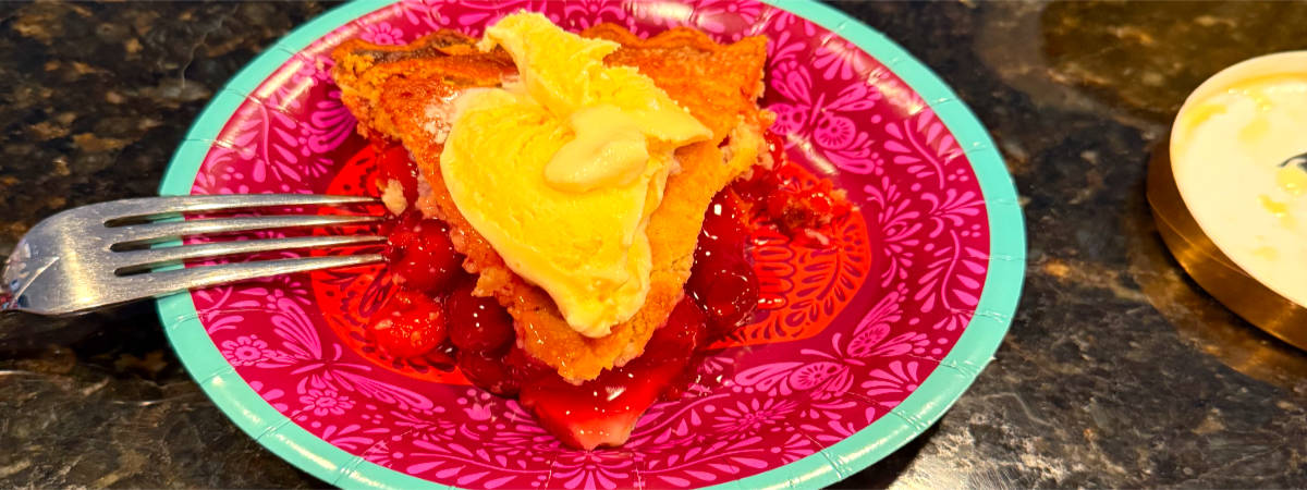 Photo: Cherry pie topped with vanilla ice cream