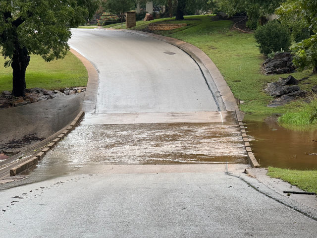 Photo: Pecan Creek flowing across the street in our neighborhood.