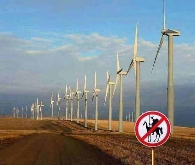 Meme - Sign prohibiting Don Quixote from tilting at modern wind turbines