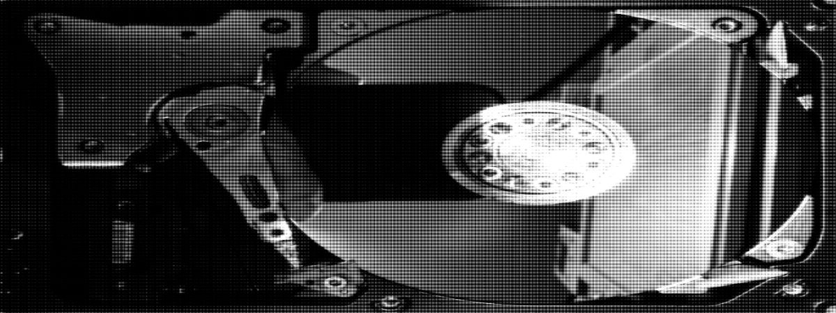 Photo (b&w): deconstructed disk drive
