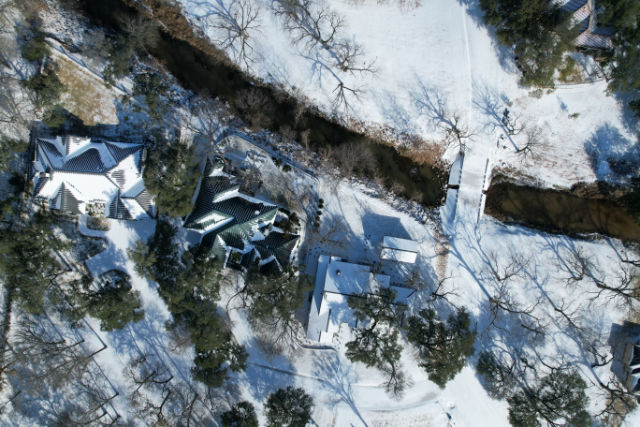 Aerial photo of ice and snow covered houses in Texas