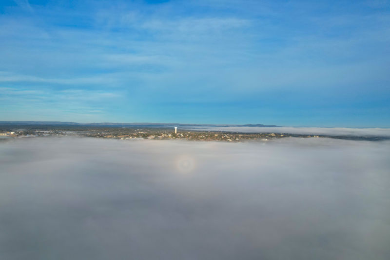 Drone photo taken from just above a fog bank