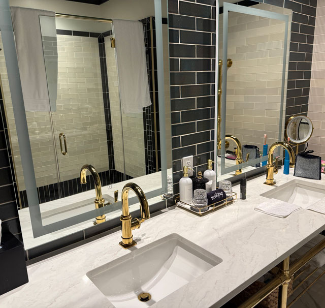 Photo: Emigrant Boutique Hotel - double sinks & mirrors in bathroom in Suite #1