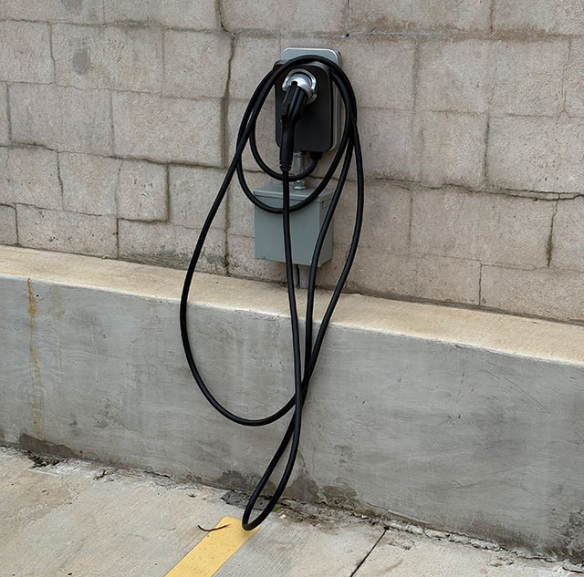 Photo: Emigrant Boutique Hotel - charging station for EVs in the parking lot